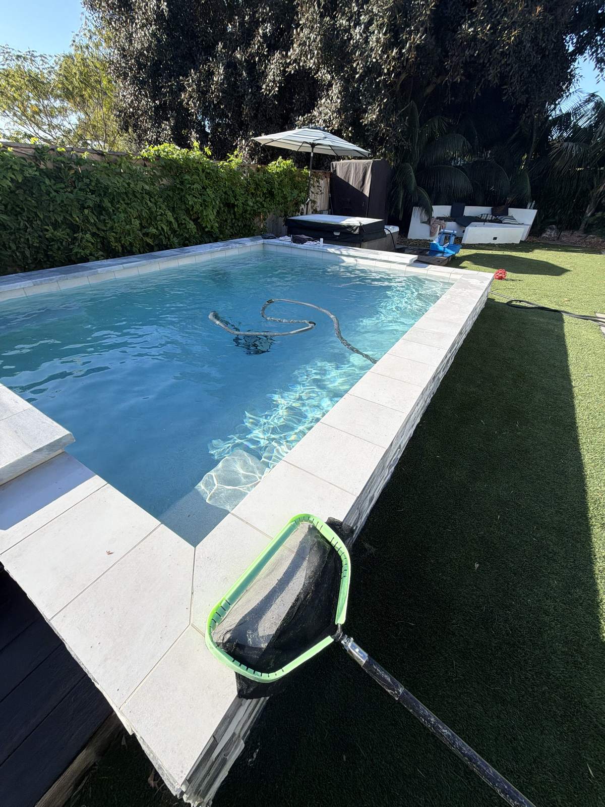 Backyard pool with spa serviced by Fairwater Pools