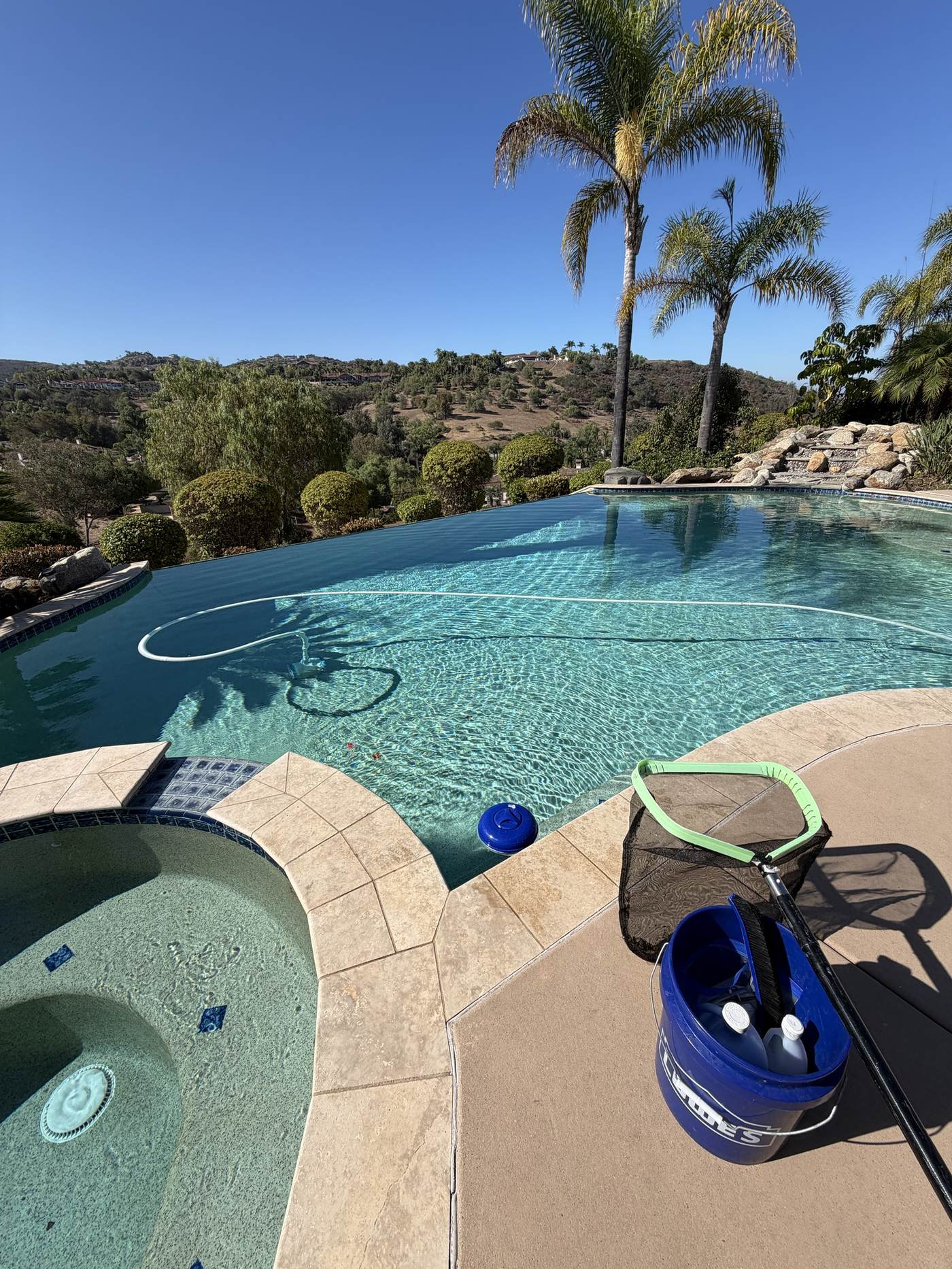 Fairwater technician's equipment beside a large residential pool
